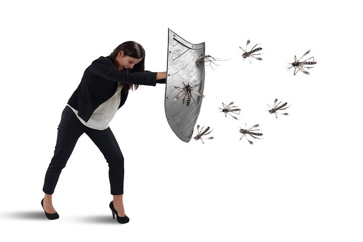 woman in dress clothes holding a shield against mosquitos
